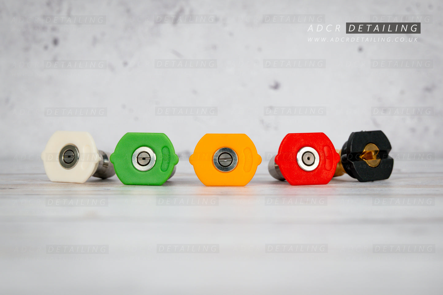 Five colour-coded spray nozzles for car detailing pressure washer guns.