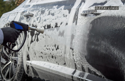 1/4in Premium Quick Release Pressure Washer Detailing Nozzle rinsing snow foam off a car.