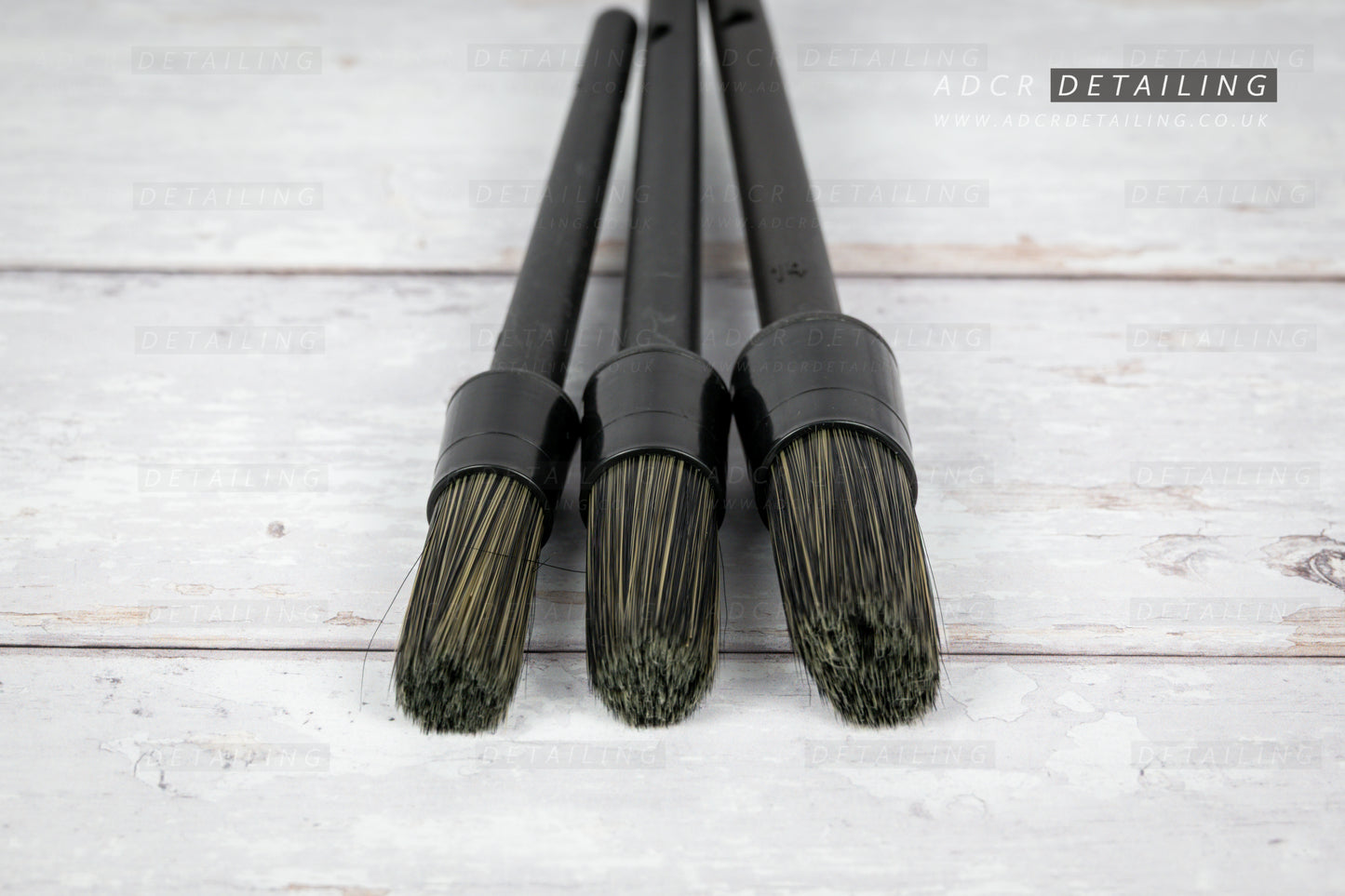 3 Exterior Detailing Brushes, perfect for cleaning intricate parts of the vehicle, like window frames, badges, logos and wheels. Close up of bristles. High quality, premium detailing brush set.
