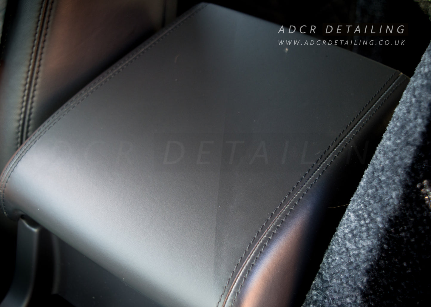 Detailing Interior Scrub Pad cleaning leather arm rest in a car. 50/50 Restoring the matt clean leather look.