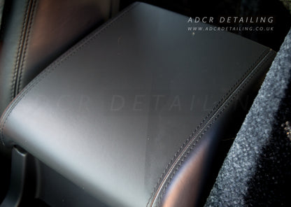 Detailing Interior Scrub Pad cleaning leather arm rest in a car. 50/50 Restoring the matt clean leather look.